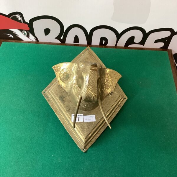 Vintage brass Indian elephant wall plaque with intricate details.