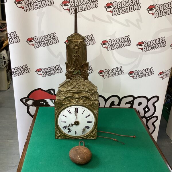 Ornate antique French Contoise clock with pendulum and weight.