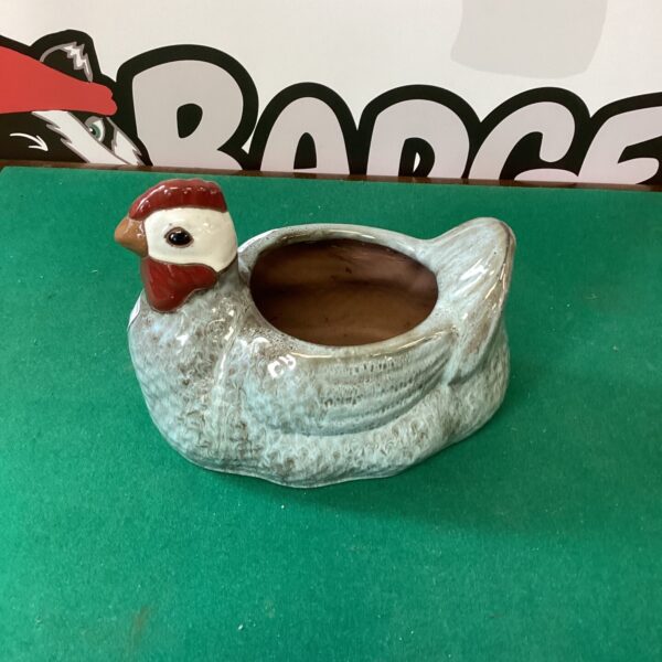 Vintage porcelain chicken planter for small plants.