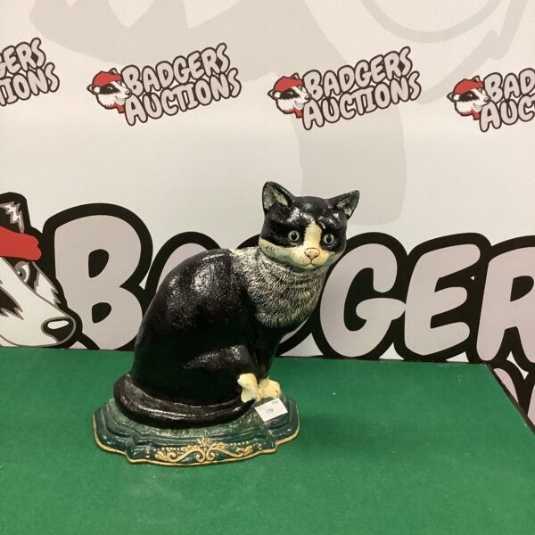 Vintage cast iron cat doorstop for antique home decor.