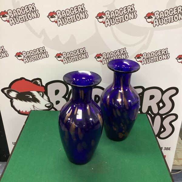 Pair of vintage cobalt blue glass vases for home decor.