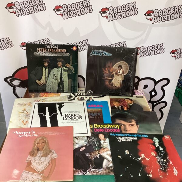 Vintage vinyl record lot featuring Gladys Knight and Nancy Sinatra.