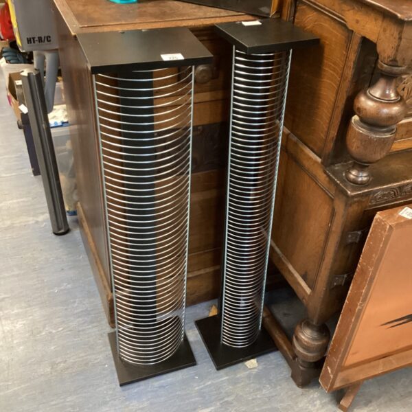 Wooden CD DVD rack for storing media collection.