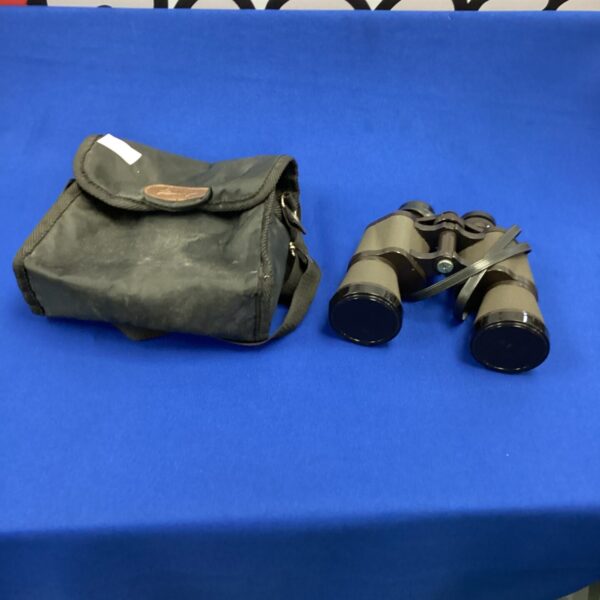 Vintage Halina Discovery binoculars in their original soft carrying case.