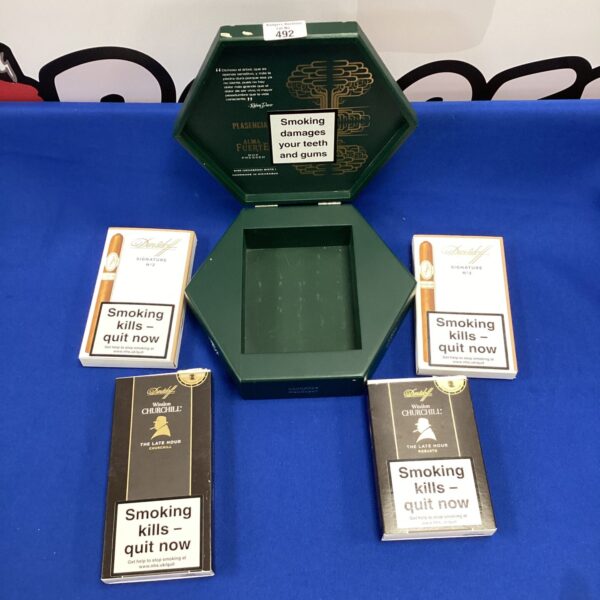 Selection of vintage cigar boxes including Davidoff and Winston Churchill brands.