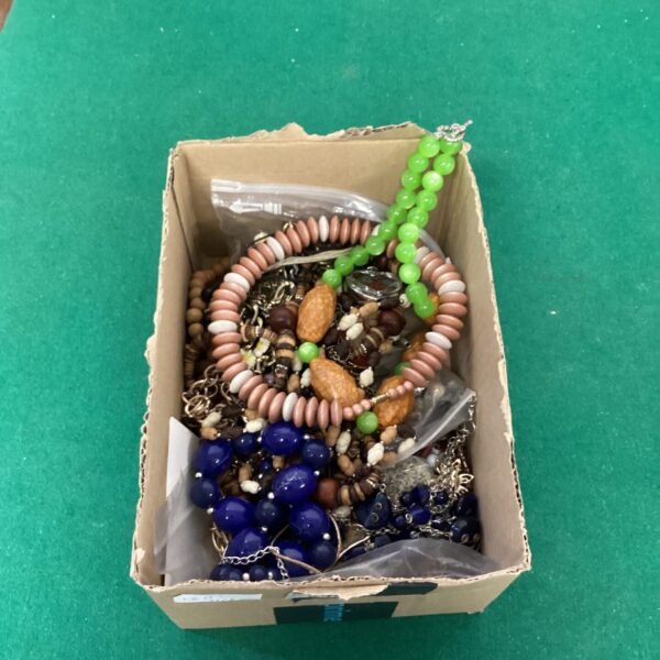 Costume jewellery lot featuring colourful bead necklaces and fashion accessories.