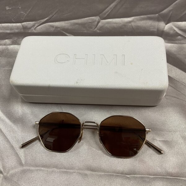 Stylish Chimi sunglasses with warm brown lenses and a classic frame.