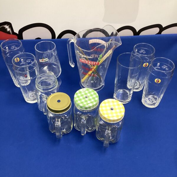 Assorted drinking jars and a Pims jug in a lot.