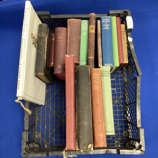 Mixed lot of antique bibles and hymn books on display.