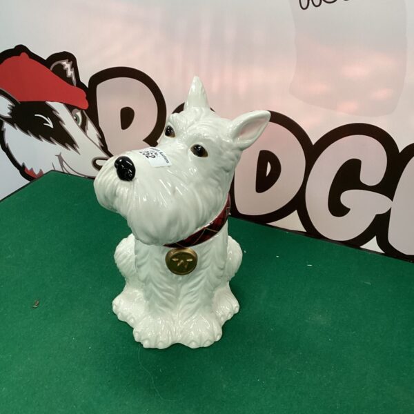 Vintage white porcelain terrier biscuit barrel with lid.