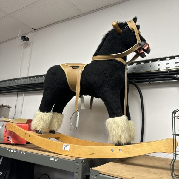 Vintage Alberta rocking horse, classic wooden toy for collectors.