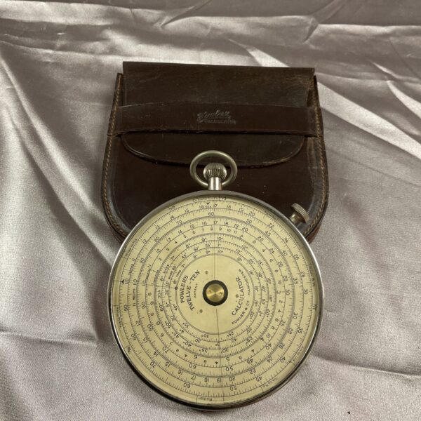 Vintage Fowler circular calculator in leather case.