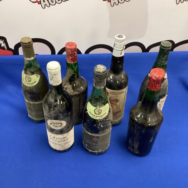 Lot of seven vintage wine bottles, including Amontillado and Rene Barbier.