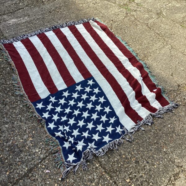 Vintage USA flag rug with stars and stripes design.
