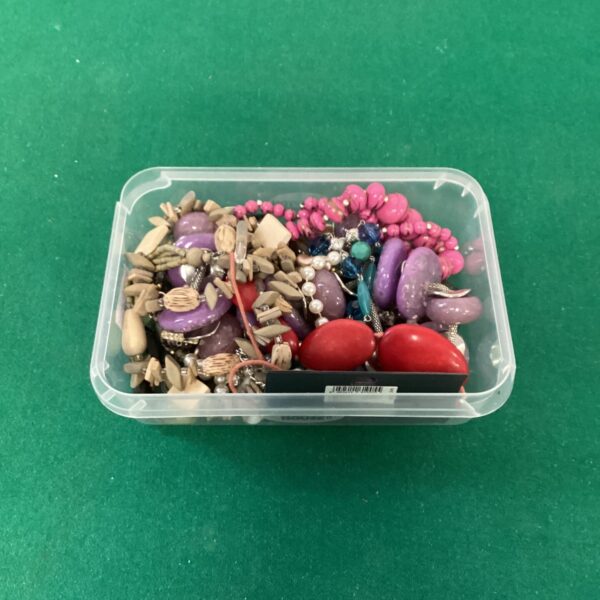 Costume jewellery lot featuring colourful beaded necklaces and fashion accessories.