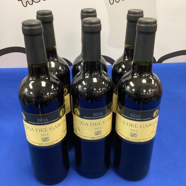 Six bottles of Vega del Garoa red wine from the 2014 vintage.