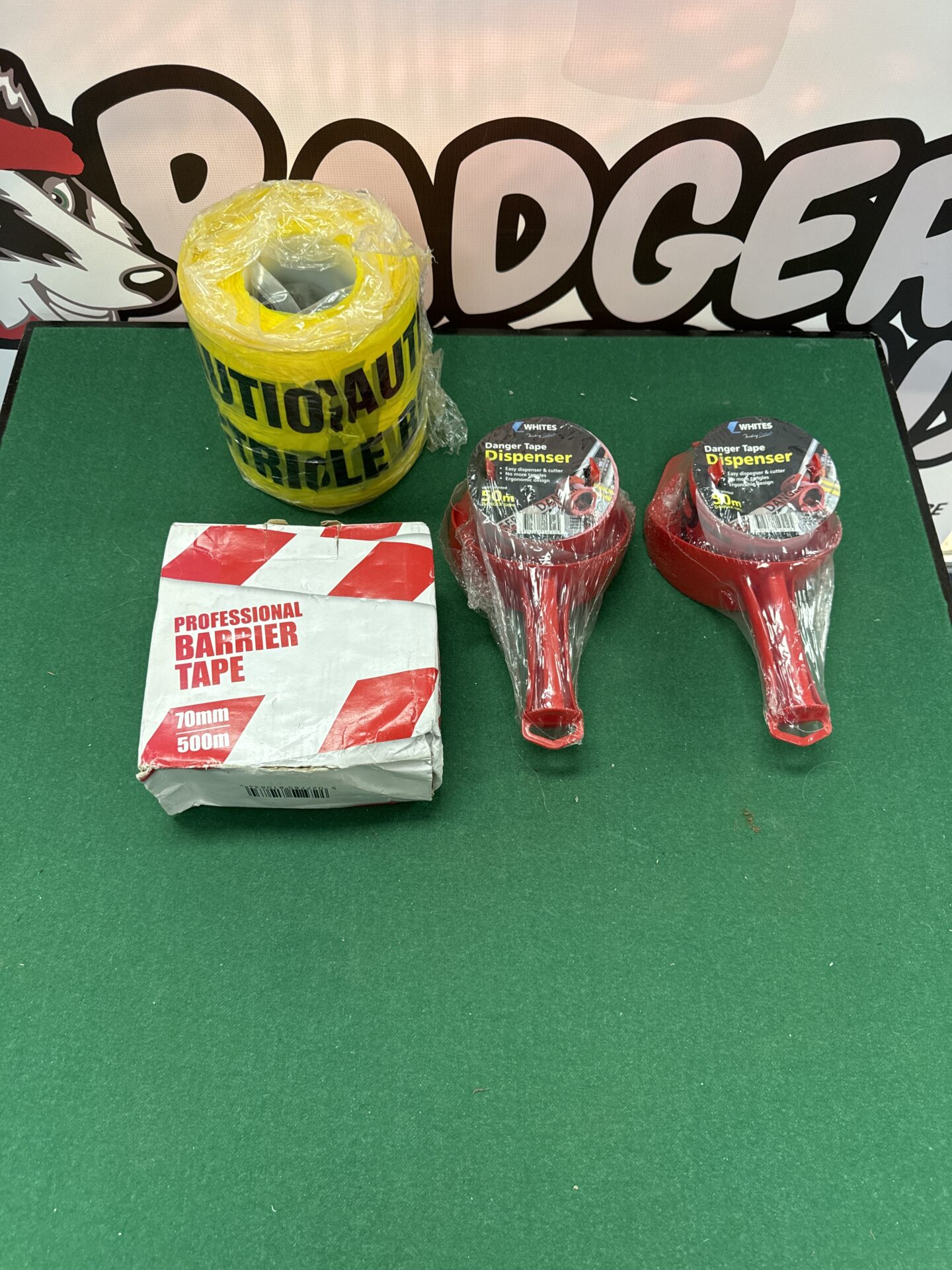 917 Two danger tape dispensers, rolls of electrical caution tape & some barrier tape
