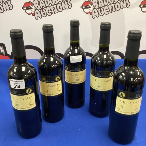 Five bottles of Vega del Garoa red wine from 2013-2015.