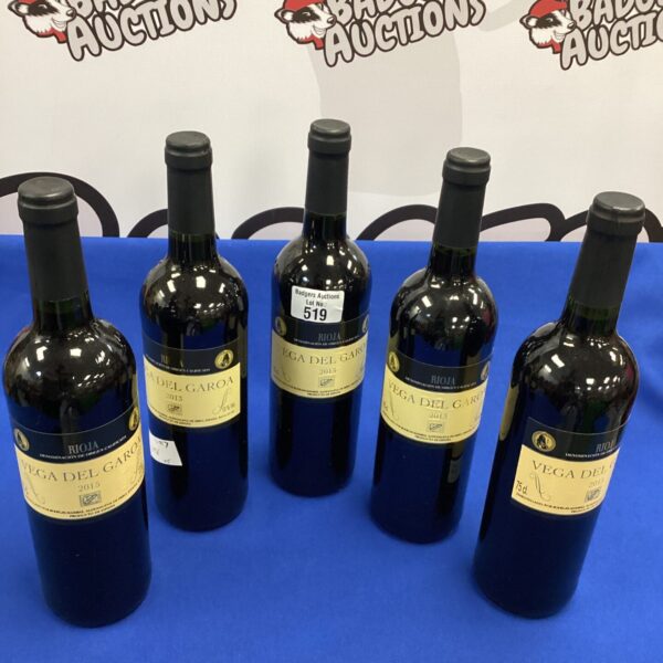 Five bottles of Vega del Garoa red wine from 2013 and 2015 vintages.