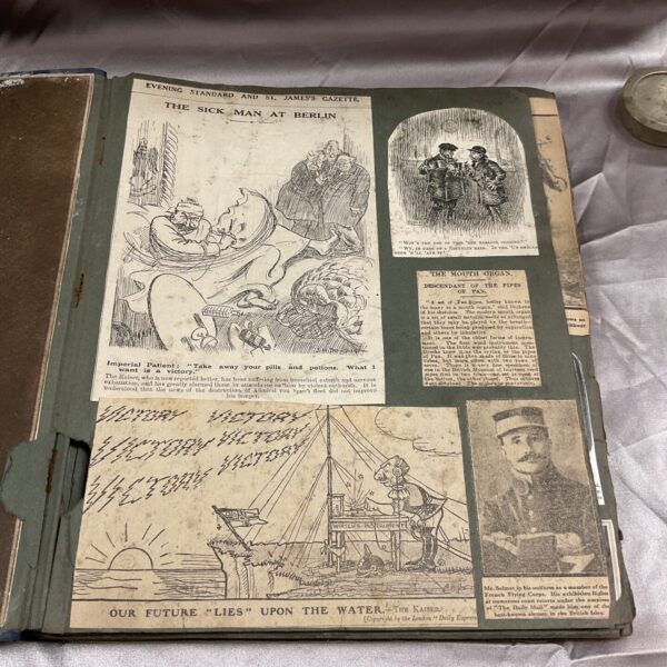 WWI scrapbook cover featuring a political cartoon.