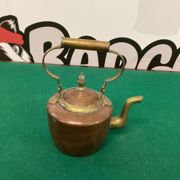 Small vintage copper kettle with patina, antique kitchenalia.