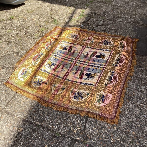 Vintage matador rug depicting a bullfighting scene with vibrant colours.