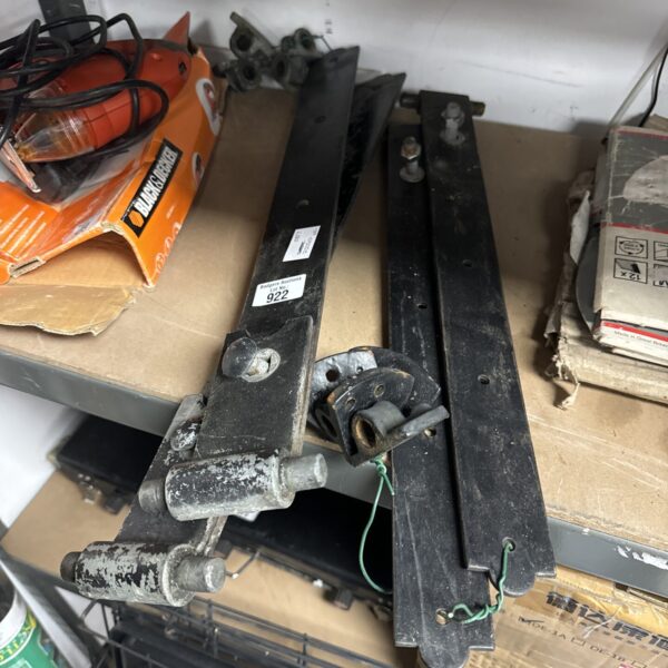 Pair of antique wrought iron gate hinges with aged patina.