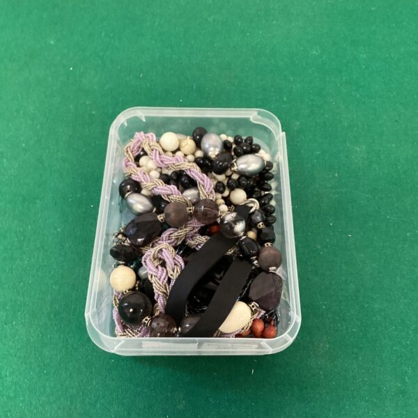 Mixed lot of costume jewellery with beads and necklaces.