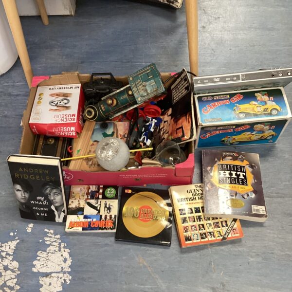 Mixed lot of vintage collectibles including toys and a book.