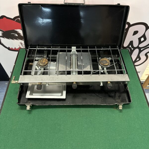 Used twin burner camping gas cooker for outdoor cooking.
