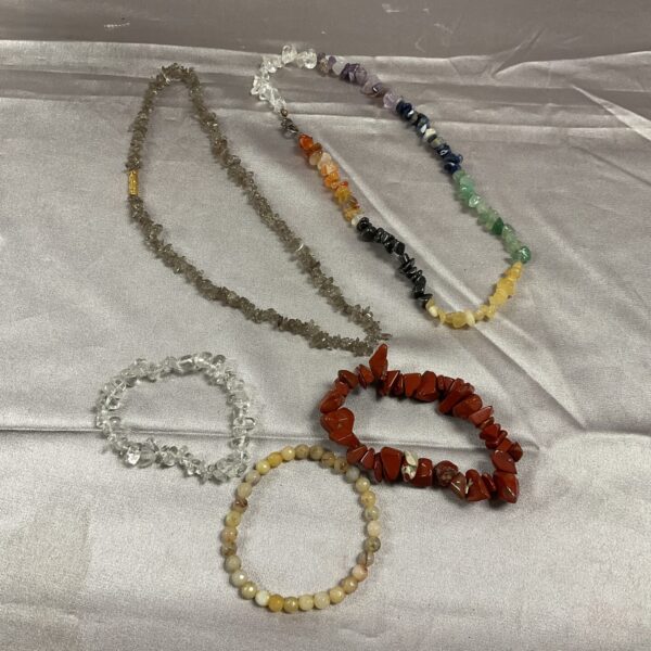 Colourful stone and crystal jewellery lot including necklaces and bracelets.
