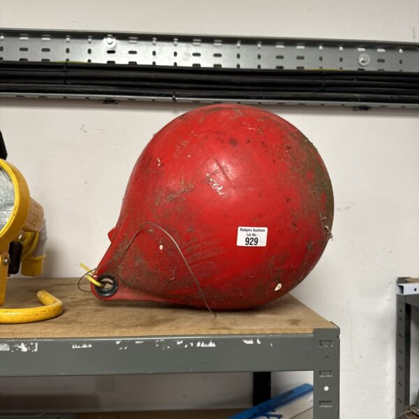 Red marine buoy for boating and navigation.