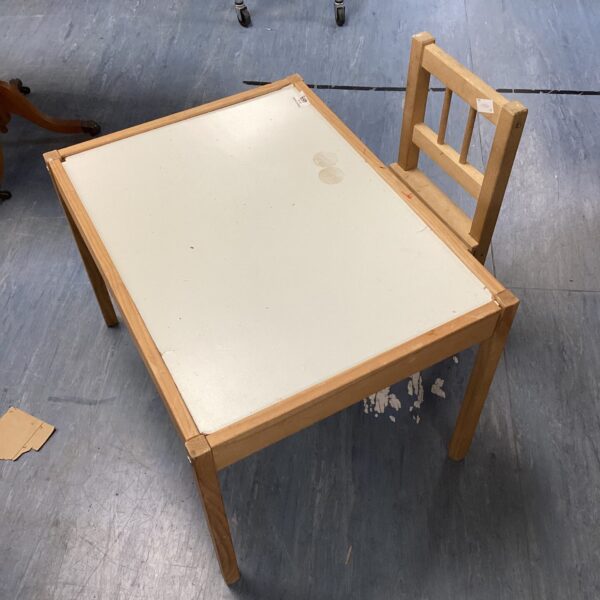 Vintage wooden child's desk and chair set for learning.
