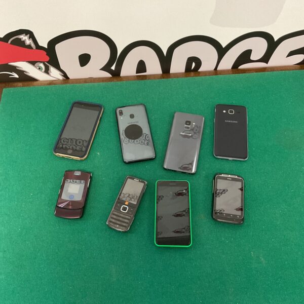 Vintage mobile phone lot including iPhone, Samsung, and Nokia handsets.