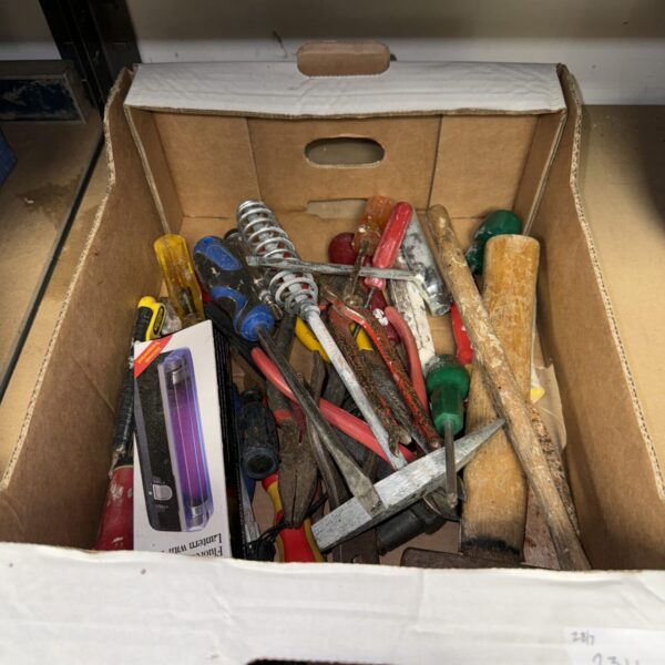 Assorted vintage hand tools in a tray, ideal for DIY projects.