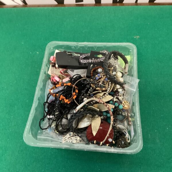 Mixed lot of colourful costume jewellery necklaces and beads.