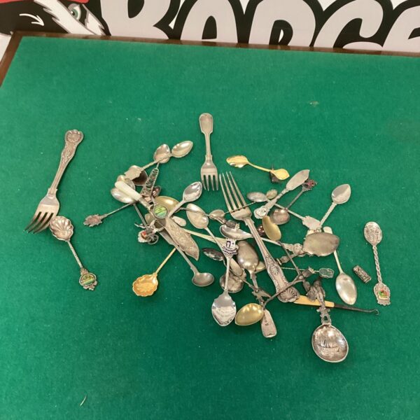Vintage collectible tea spoons and silverplate tableware collection.