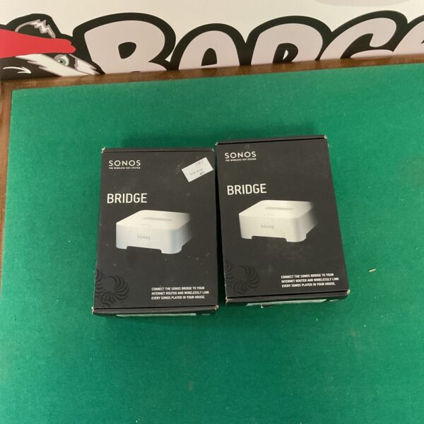 Two Sonos Wireless Bridges, model ZP90, for extending wireless audio range.