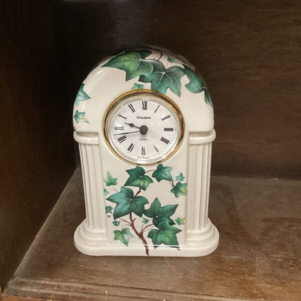 Grayshott porcelain mantle clock with ivy pattern.