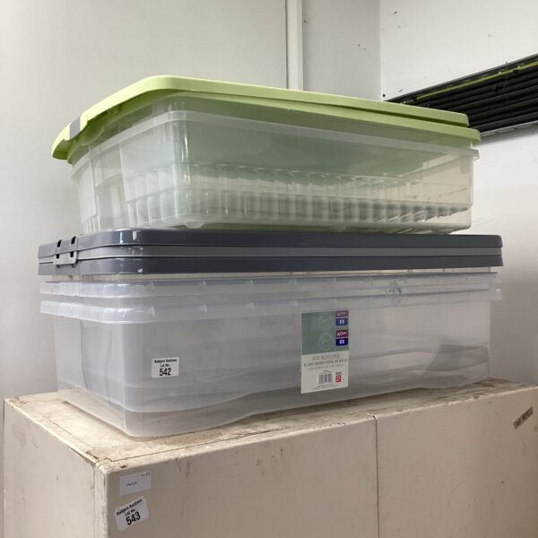 Clear plastic storage tubs with lids for household organisation.
