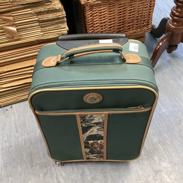 Green vintage Carlton suitcase, classic travel luggage.