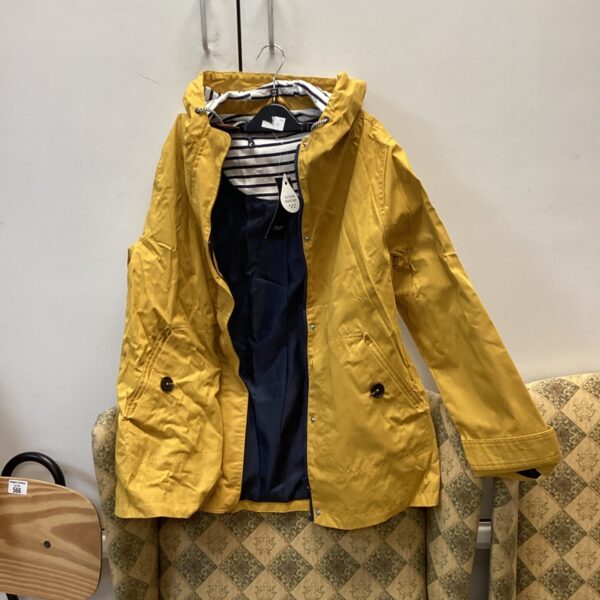 New yellow F&F raincoat size 16, waterproof and stylish.