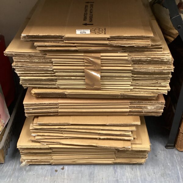 Stack of flat-packed cardboard storage boxes for moving.