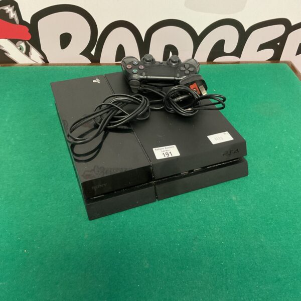 Sony PlayStation 4 console with controller, gaming system.
