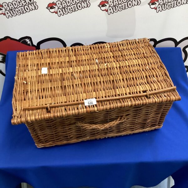 Vintage wicker basket with a classic woven pattern.