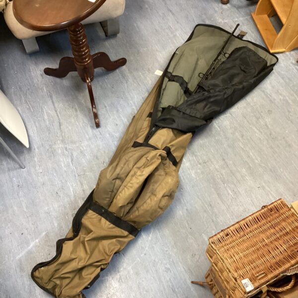 Olive green fishing rod sleeve for multiple rods.