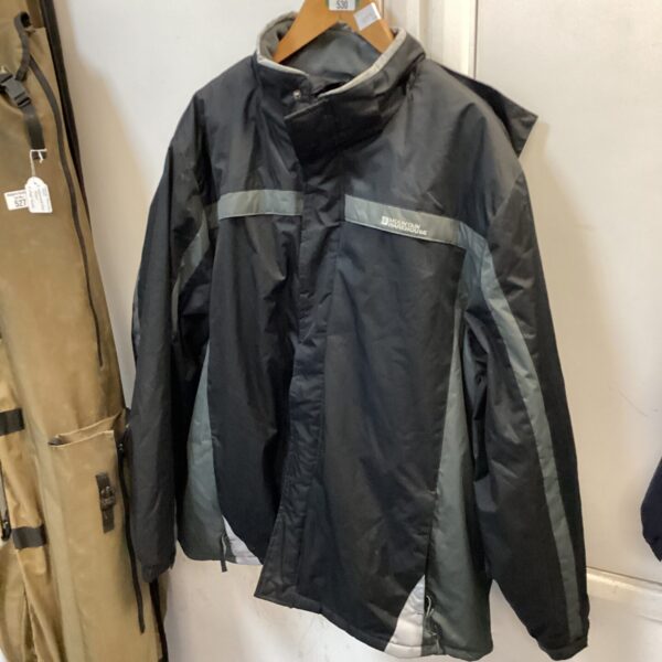 Black and grey XXXL Mountain Warehouse waterproof coat for outdoor use.
