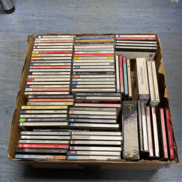 Box of assorted classical music CDs for collectors.