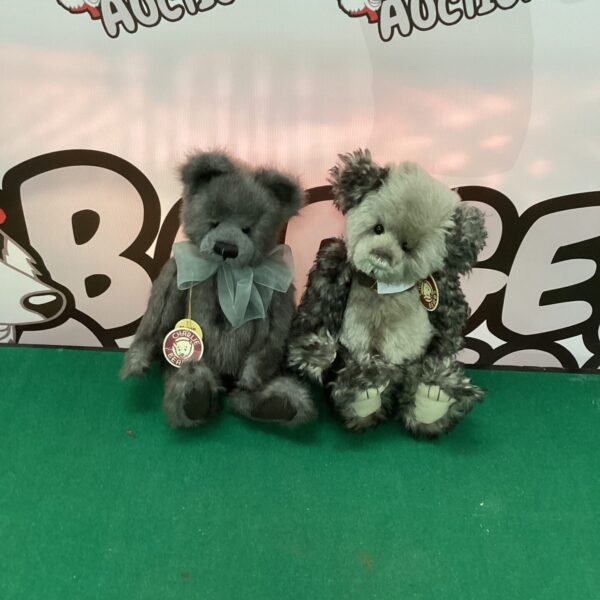 Pair of collectible Charlie Bears teddy bears with bows.