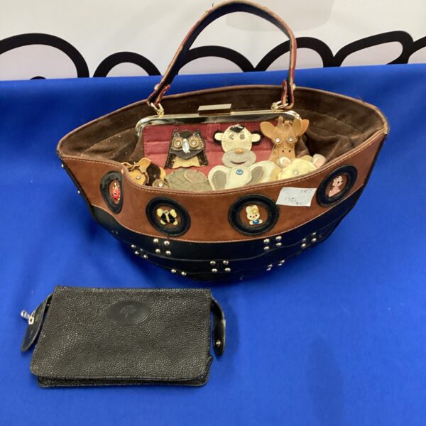 Vintage Noahs Ark handbag with sculpted animals on black leather.